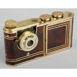 Petie Vanity Camera, burgundy marble with gilt metalwork, body, G, a few chips in the enamel