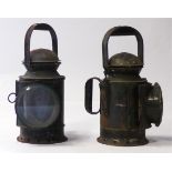 A pair of British Railways Guards lamps, both in black , one with revolving red and green lens and