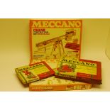 boxed post-war Meccano, Four sets comprising Outfit no1, Outfit no 6, and Motorised Crane