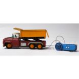 SKK Japanese Dumping Truck, battery operated, red/orange tinplate body with plated trim and