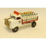 Tri-ang Milk Truck, White and red tin plate with rubber tyres marked L Bros Ltd, complete with 28