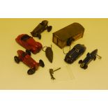 Schuco Toys, 1950s Tin plate Schuco garage, three wind-up cars models 1750, 4001, racing car, and