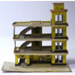 Mettoy Tinplate Shell Garage, three tiers, red and yellow lithoprinted structure with three orange