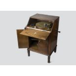 cabinet gramophone, Apollo: a small gramophone of bureau form in walnut with Art Deco banding, the