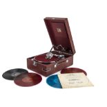 Portable gramophone,with records: an HMV Model 102c, in red case, with 5B sound box, 1940; and 75