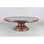 An Edwardian mahogany lazy susan, on socle rotating base, 52 cm diameter