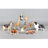 A collection of Beswick, Goss and other china items, including a German shepherd, a camel, Goss