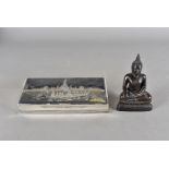 A Siam silver cigarette box, with niello work design of dragon boat against a large temple, 21 cm