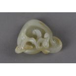 An early 19th Century Chinese jade weight, carved as mushrooms with intertwined stems, polished to