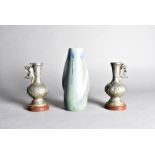 A French art nouveau stoneware vase, by Denbace, the green mottled ground with a blue drip glaze,