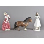A Beswick model of a Shetland Pony, marked Berwick to foot, together with a Royal Doulton