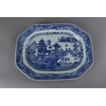 A 19th century Chinese porcelain octagonal charger, decorated in the willow pattern within a