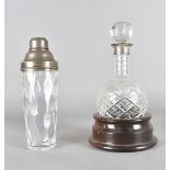 A presentation cut glass and silver decanter, the silver collared bottle with matching stopper