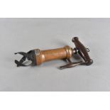A 19th Century Lund's Queens Patent Corkscrew, having rosewood handle with remains of brush, ratchet