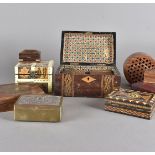 A collection of treen boxes, to include an inlaid example, a carved Indian box, various cigarette