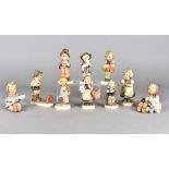 Ten Hummel figures, some af, including little gardener, the lost sheep, street singer, joyful and