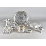 A collection of silver plated items, including various pint tankards, a melon shaped teapot,