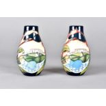 A pair of modern Moorcroft ovoid vases, with tube lined decoration of a sleeping prince on a