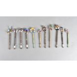 A collection of boxwood and bone lace makers bobbins, all with decorative beads, some named, all