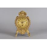 An early 19th Century ormolu bombe shaped mantel clock, in the baroque style with single fusee
