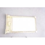 A gilt Regency style mirror, having barley twist supports either side glass with central shell and