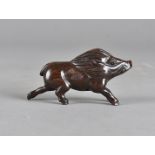 A Japanese hardwood netsuke, carved as a wild boar with black glass eyes, signed to base, 8 cm