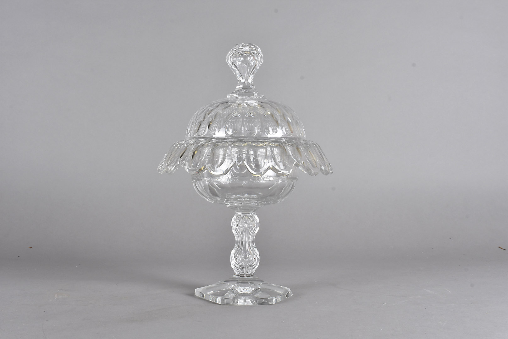 A 19th Century cut glass bon bon dish and cover, the faceted bowl supported on a waisted double