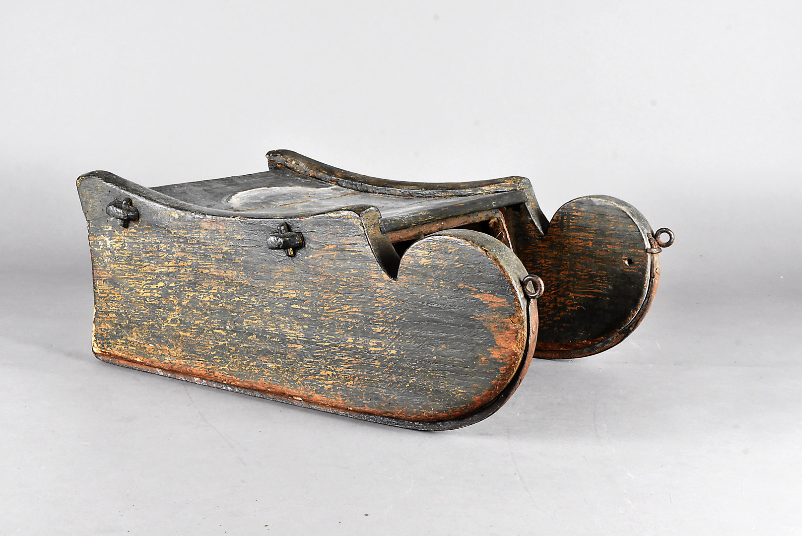 A late 19th Century stained pine child's sleigh, 47 cm long