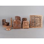 A collection of treen book troughs, and book ends including an Indian carved example, and various