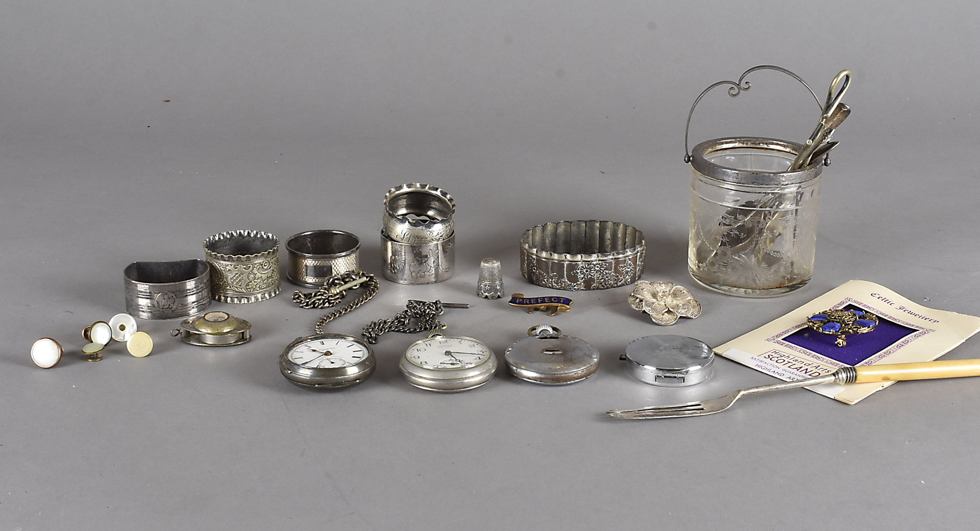 A collection of napkin rings, a silver open faced fob watch, various items of costume jewellery etc