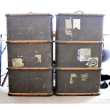 Two 1930s canvas covered and beech bound travelling trunks, with various travel labels and brass