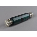 A 19th century green glass double ended scent bottle, with white metal screw cap to one end, and