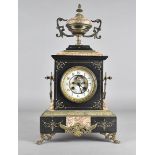 A 19th Century marble architectural mantel clock, with eight day movement, white enamel face,