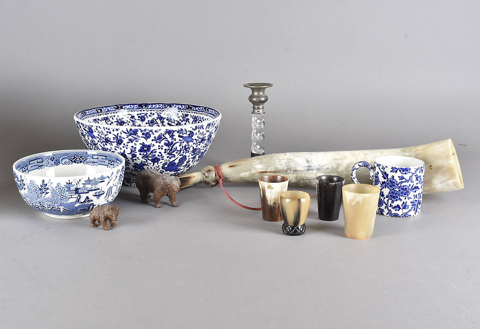 A collection of blue and white china, including bowls, together with an elastoline bear, a carved