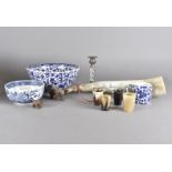 A collection of blue and white china, including bowls, together with an elastoline bear, a carved