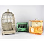 Three vintage bird cages, including a domed example, 51 cm high, a railway carriage and another made