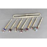 A quantity of bone decorated lace makers bobbins, all with decorative beadwork, all turned bodies,