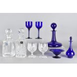 A Bristol blue glass ships decanter, together with a pair of wine glasses, a Bristol blue glass