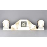 An art deco light marble clock garniture, of architectural form, supported on rectangular plinth