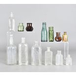 A collection of Victorian and later bottles, to include coloured and plain examples