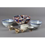 Two Japanese wine flagons, and sake cups, an imari bowl, two Chinese blue and white rice bowls, an