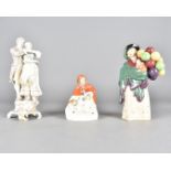 A Royal Doulton figure, Balloon Seller, HN 563, together with a continental porcelain figure of