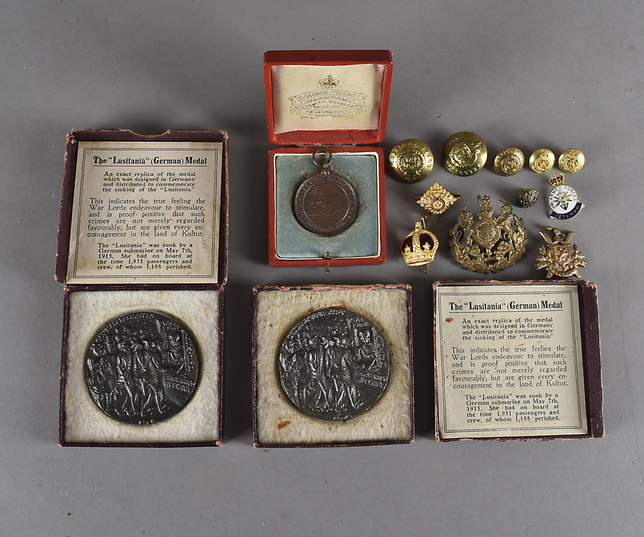 Two replica Lusitania medals, after Karl Groetz, together with a Royal Life Saving Society Medal