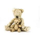 Two post-war Chad Valley teddy bears: the larger with blonde mohair, black stitched nose and