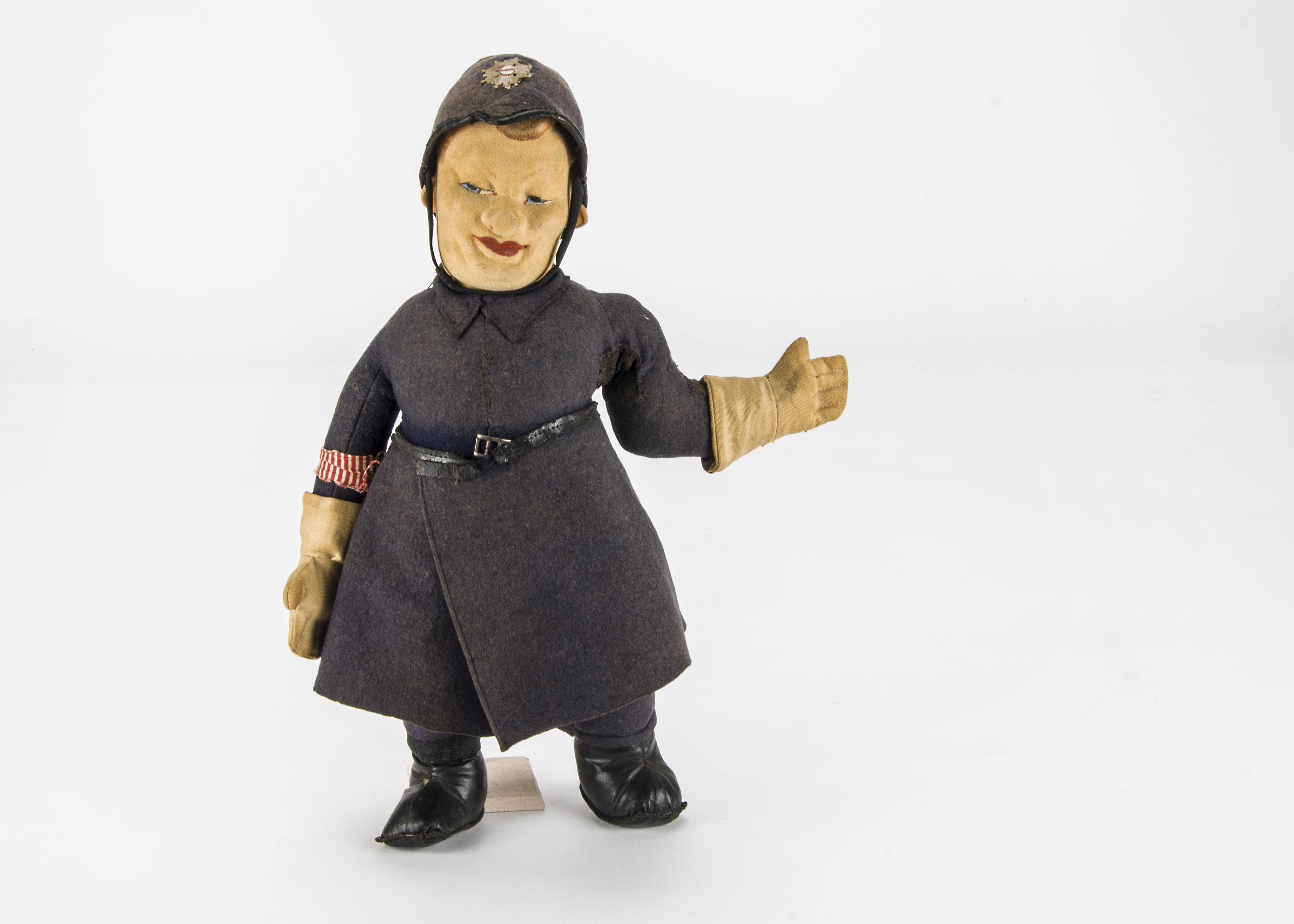 An Allwin British traffic policeman cloth doll 1930s, with press brushed cotton face, felt