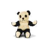 A Chiltern unjointed post-war Panda, with black and white mohair, orange and black glass eyes, black