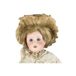 An A. Lanternier & Cie child doll, with fixed blue glass eyes, open mouth, pierced ears, blonde