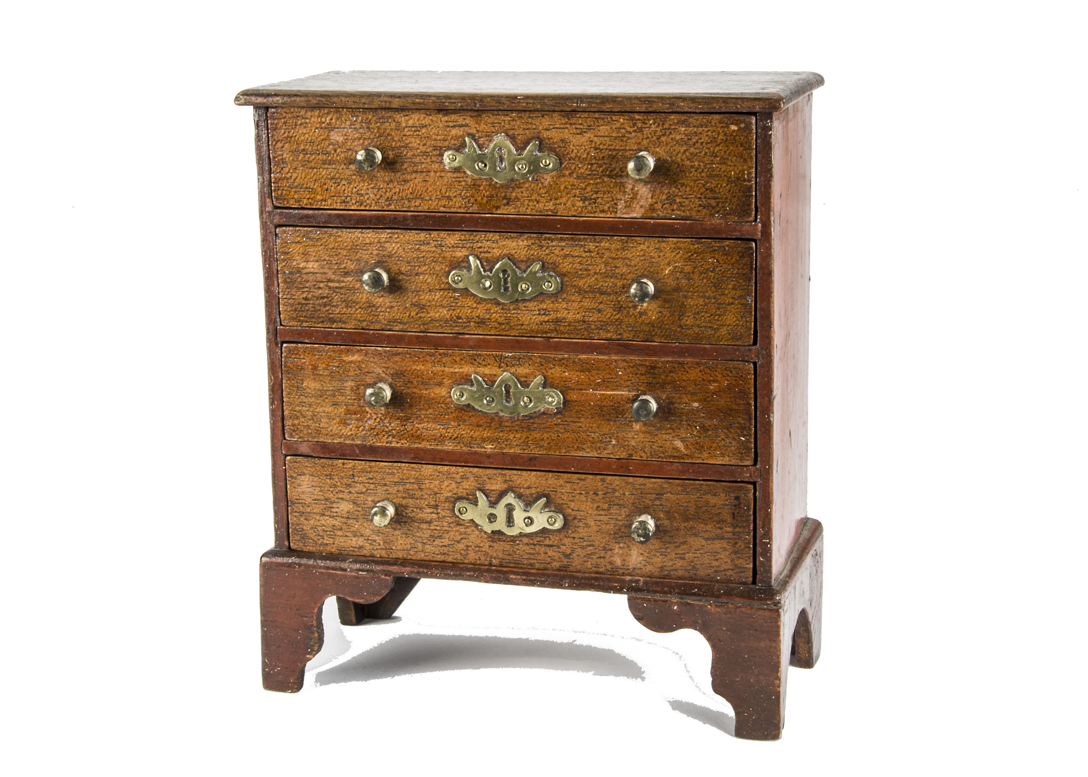 A rare Bubb doll’s chest of drawers 1820-30s, with four drawers, brass knobs and escutcheon