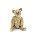 An early German teddy bear 1910-20s, with blonde mohair, black boot button eyes set close