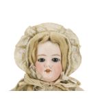 An unmarked German bisque head doll, with dark blue sleeping eyes, blonde mohair wig, jointed